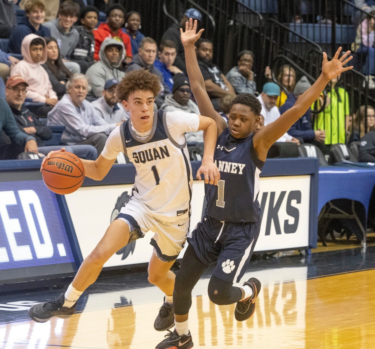 Darius Adams works his way in toward basket as MeSean Williams covers him. Manasquan Boy's basketball defeats Ranney 61-46 in Shore Conference Final in West Long Branch on February 19, 2023.